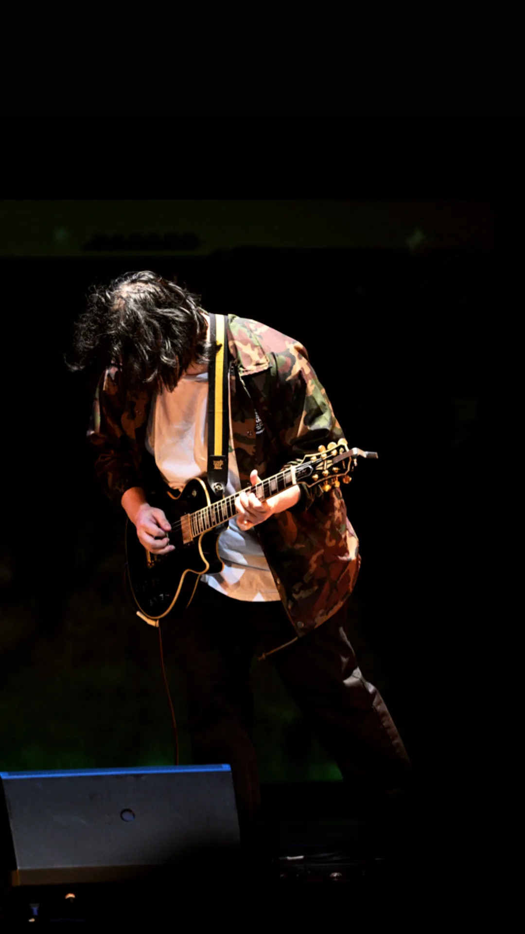 Yiqin Chen playing electric guitar